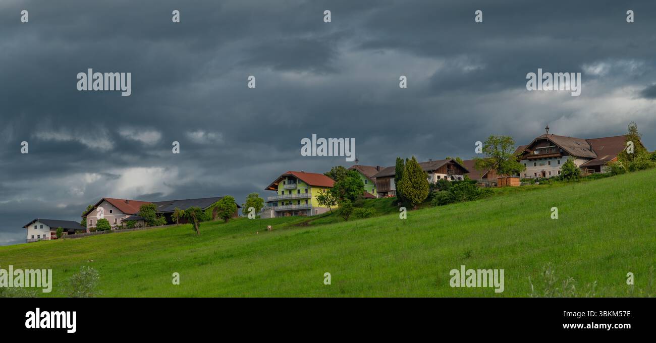 Cloudy fresh morning sunrise with houses near lake Wallersee Austria 06 05 25 Stock Photo