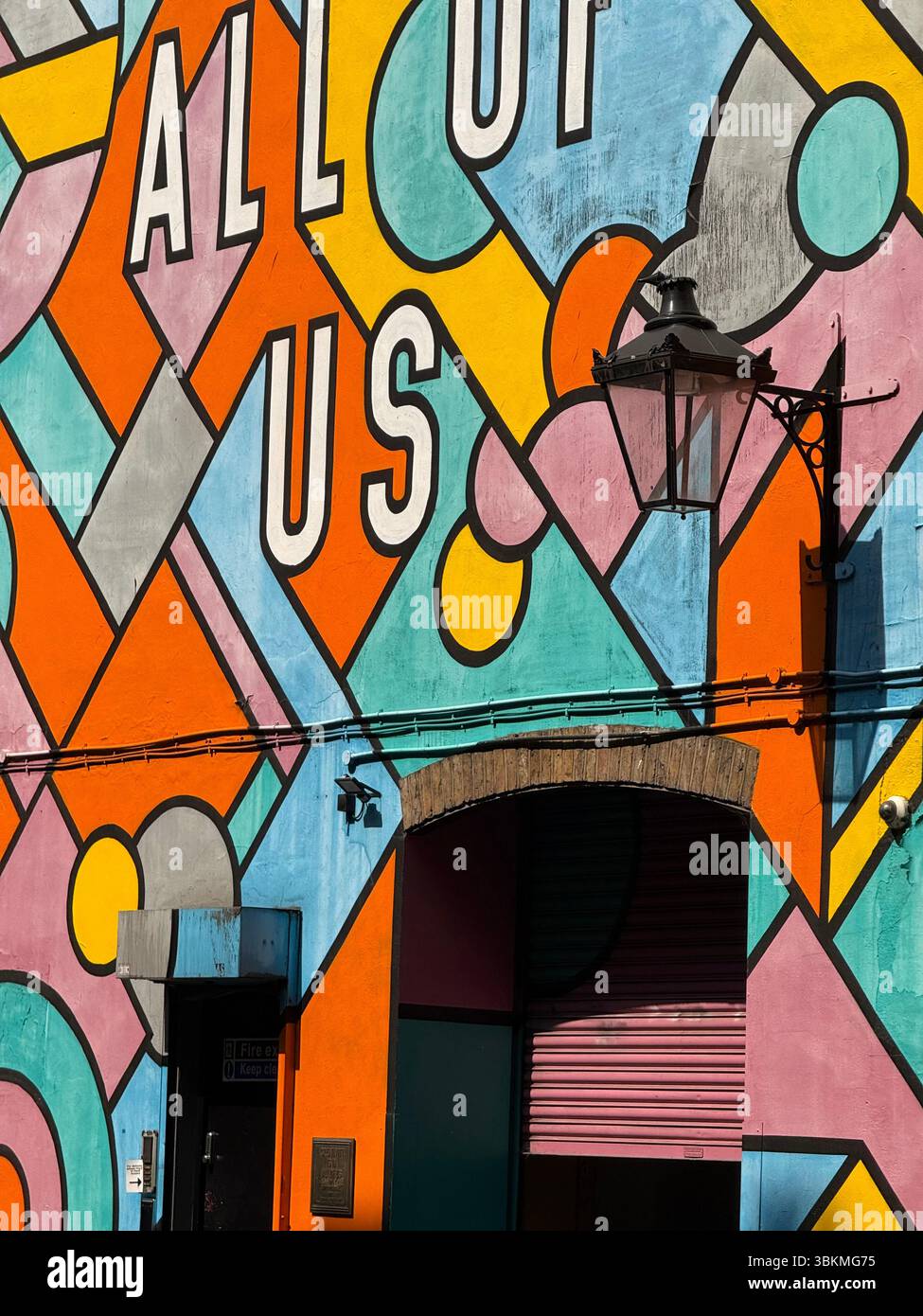 Shadows, lamp and detail of wall mural on the London Graphic Centre building on Mercer Street - Smartphone Captured Stock Image