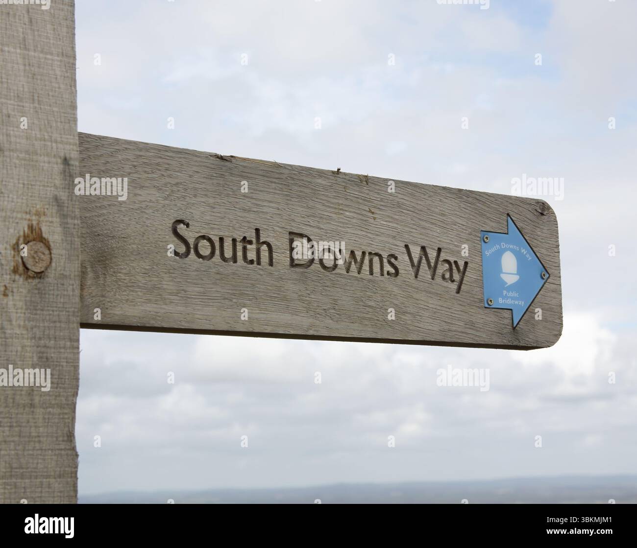 signs pointing the direction of the south downs way at firle in east ...