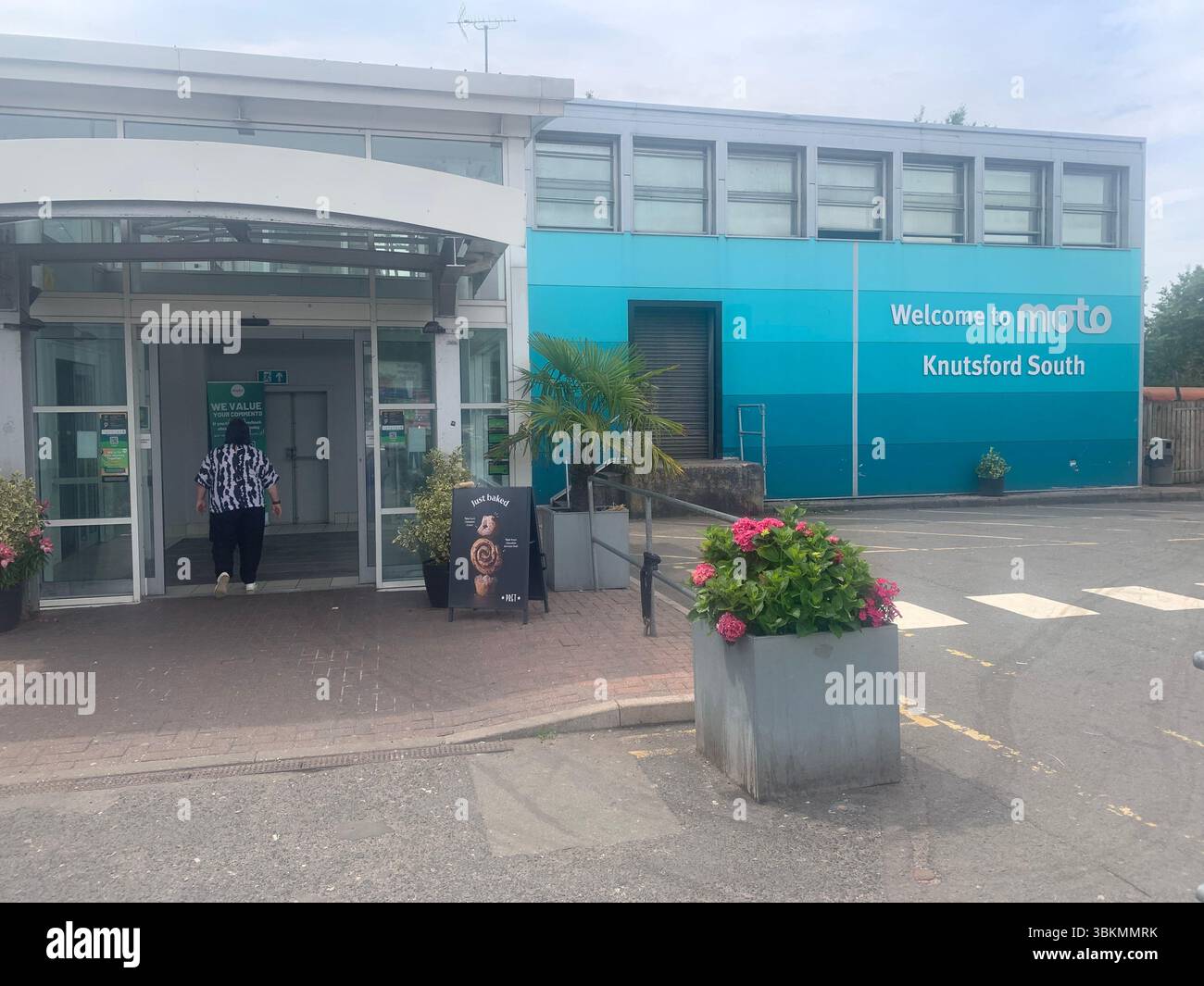 Moto Knutsford South Lake District UK fuel petrol electricity charging points point flowers food drink power services welcome arrive eating drinking - Smartphone Captured Stock Image