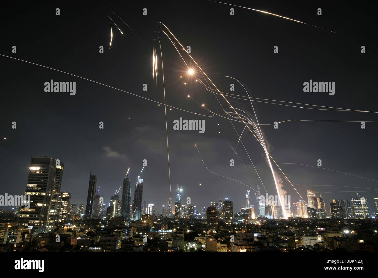 FILE - Israeli Iron Dome air defense system fires to intercept missiles over Tel Aviv, Israel, on June 13, 2025. (AP Photo/Leo Correa, File) Stock Photo