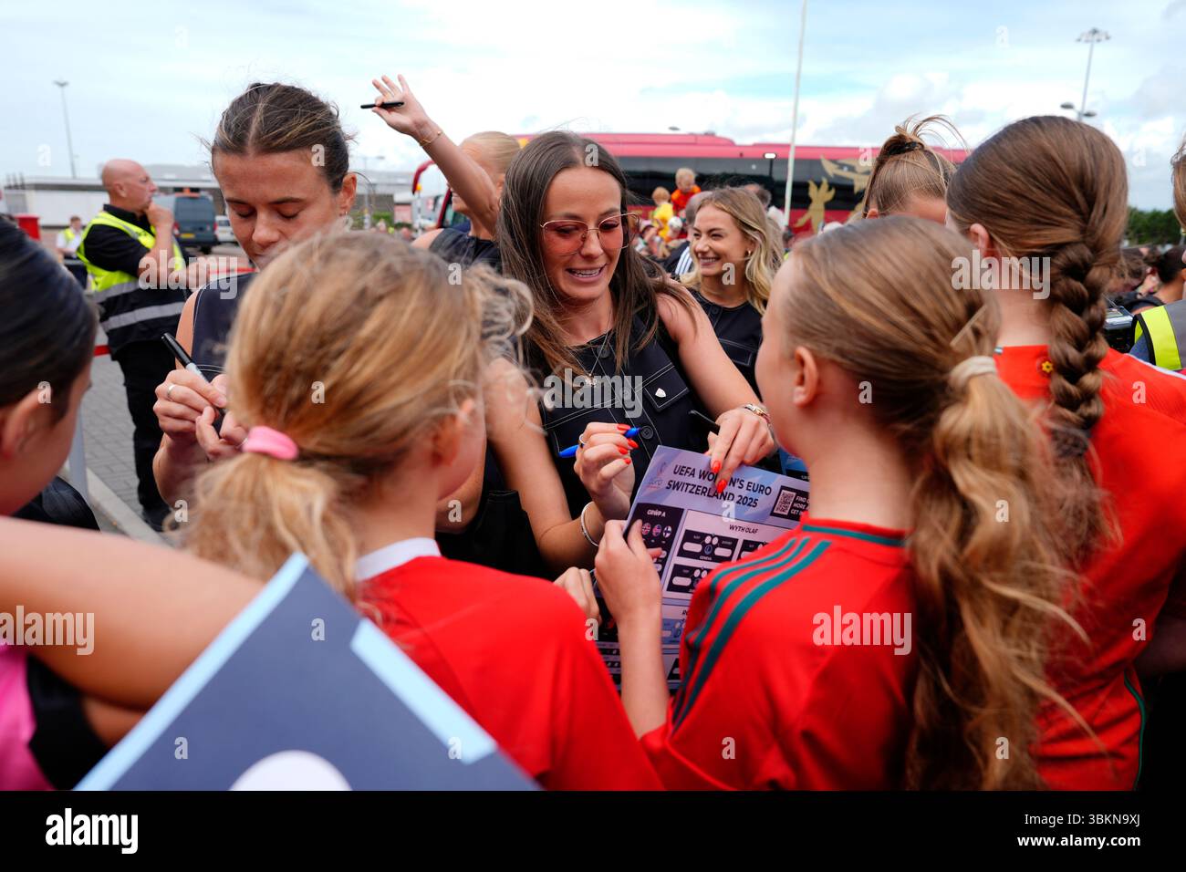 Wales' Hannah Cain autographs fans merchandise at Cardiff Airport ...