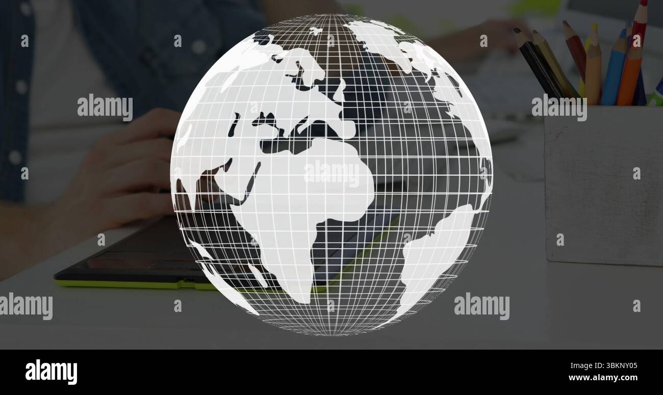Hands hovering using stylus on tablet at desk, with floating wireframe globe colored pencil holder Stock Photo