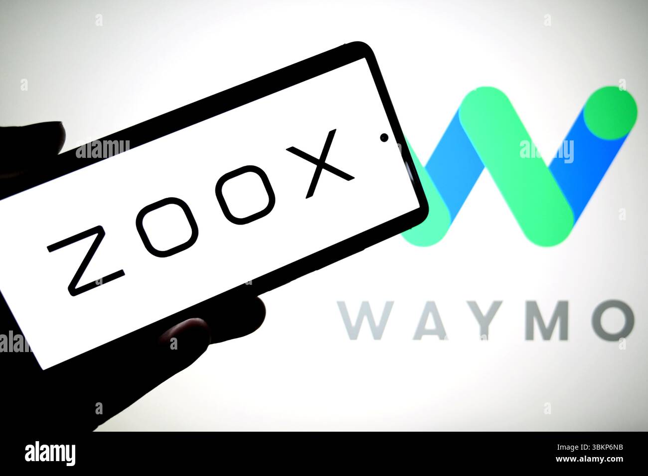 In this photo illustration, a Zoox logo is seen displayed on a ...