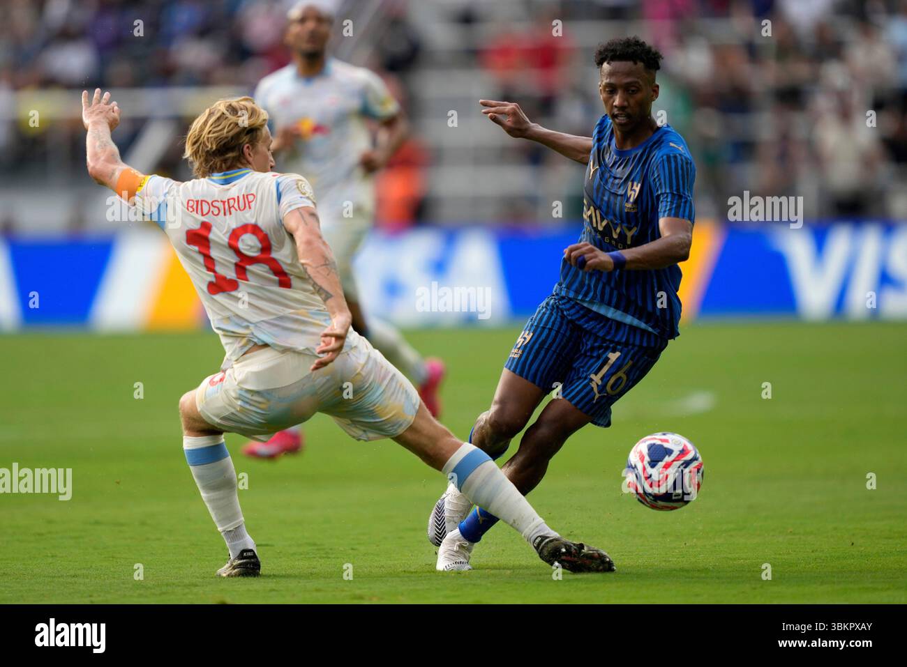 Red Bull Salzburg's Mads Bidstrup, left, challenges Al-Hilal's Nasser ...