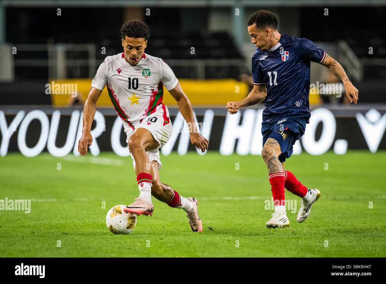 Suriname midfielder Denzel Jubitana (10) keeps the ball away from ...