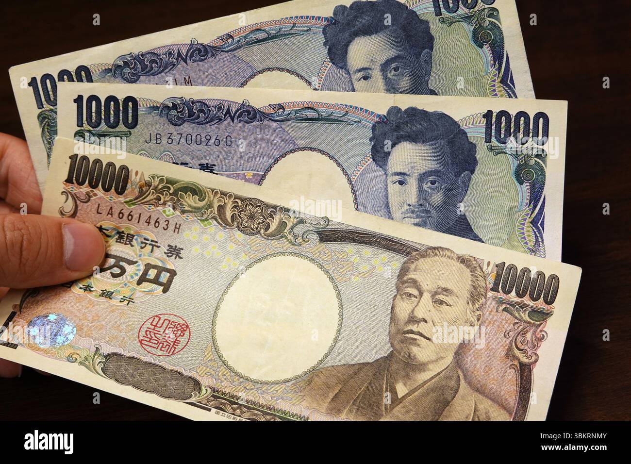 Yen Banknotes Set China. 22nd June, 2025. In this photo illustration, a hand holds ...