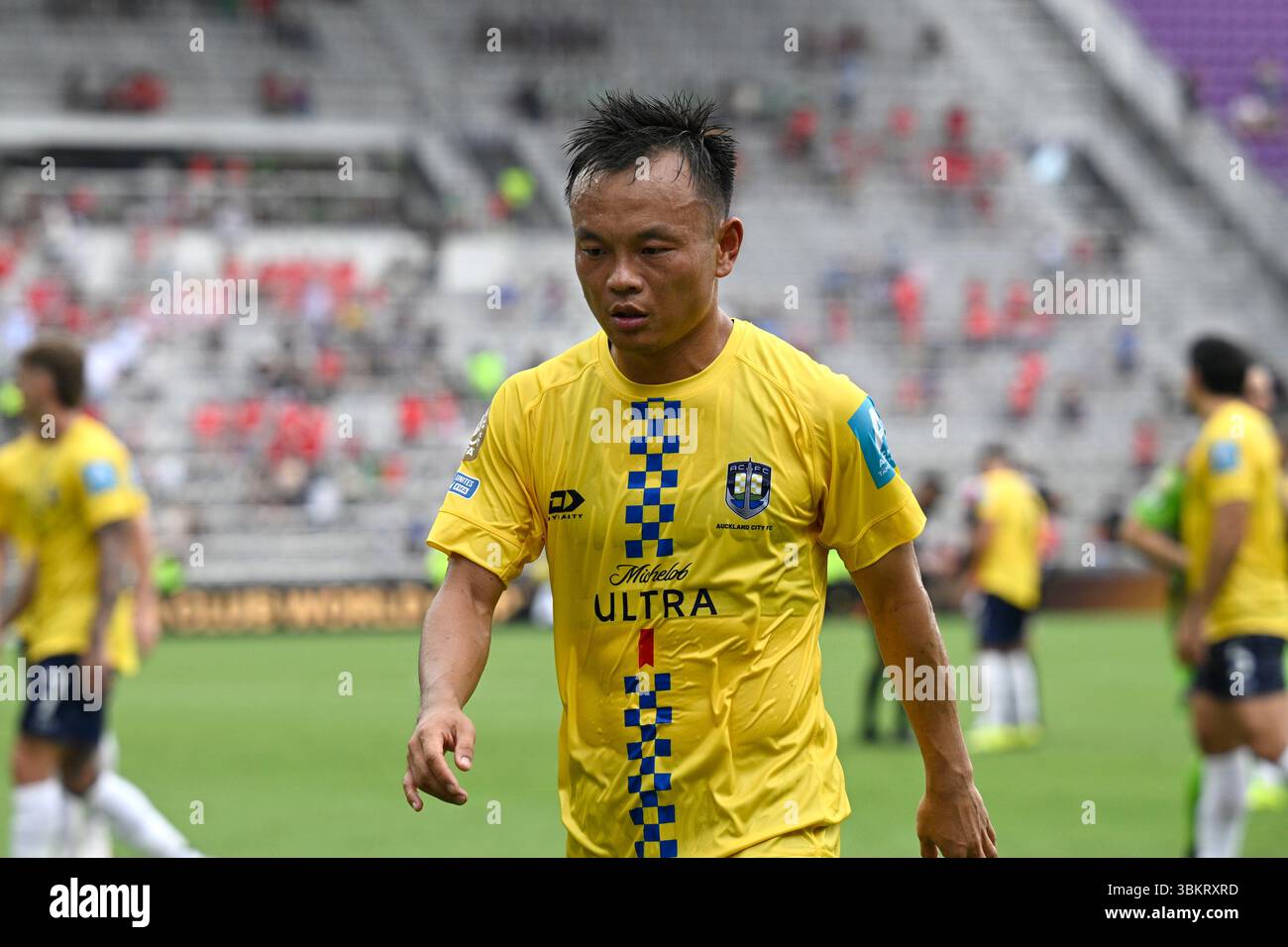 Auckland City's Tong Zhou leaves the pitch after the first half of a ...