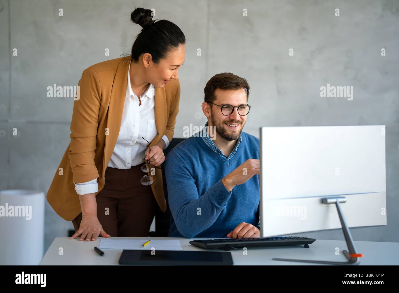 Mixed team of software engineers brainstorming ideas. Diverse app developers collaborating as group Stock Photo
