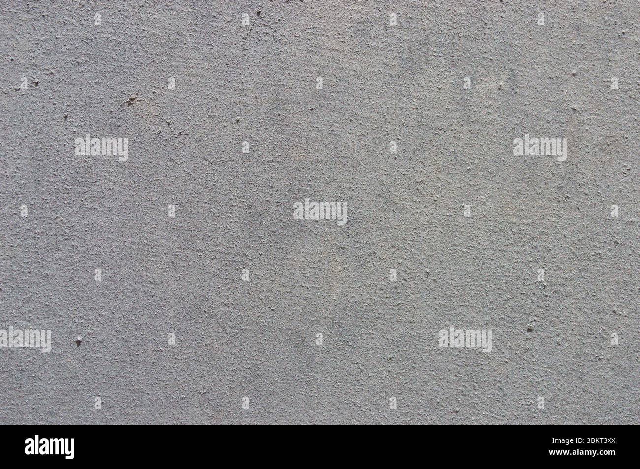 Light grey concrete or rendered stucco wall texture full frame background. Stock Photo