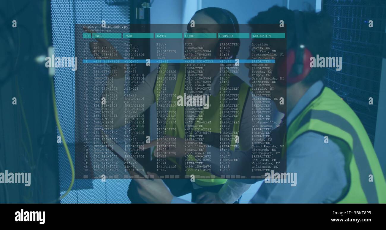 Inspecting technicians wearing hi vis vests checking server cables in server room, with clipboard Stock Photo