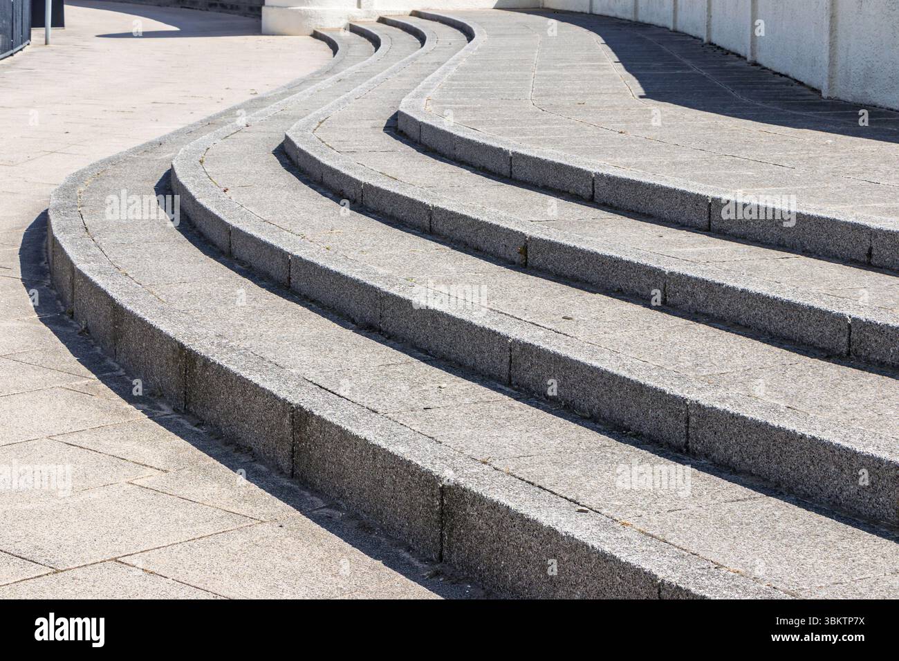 Curved stone steps with a gradually ascending design in an urban setting, showcasing modern architecture seaton carew art deco bus station Stock Photo