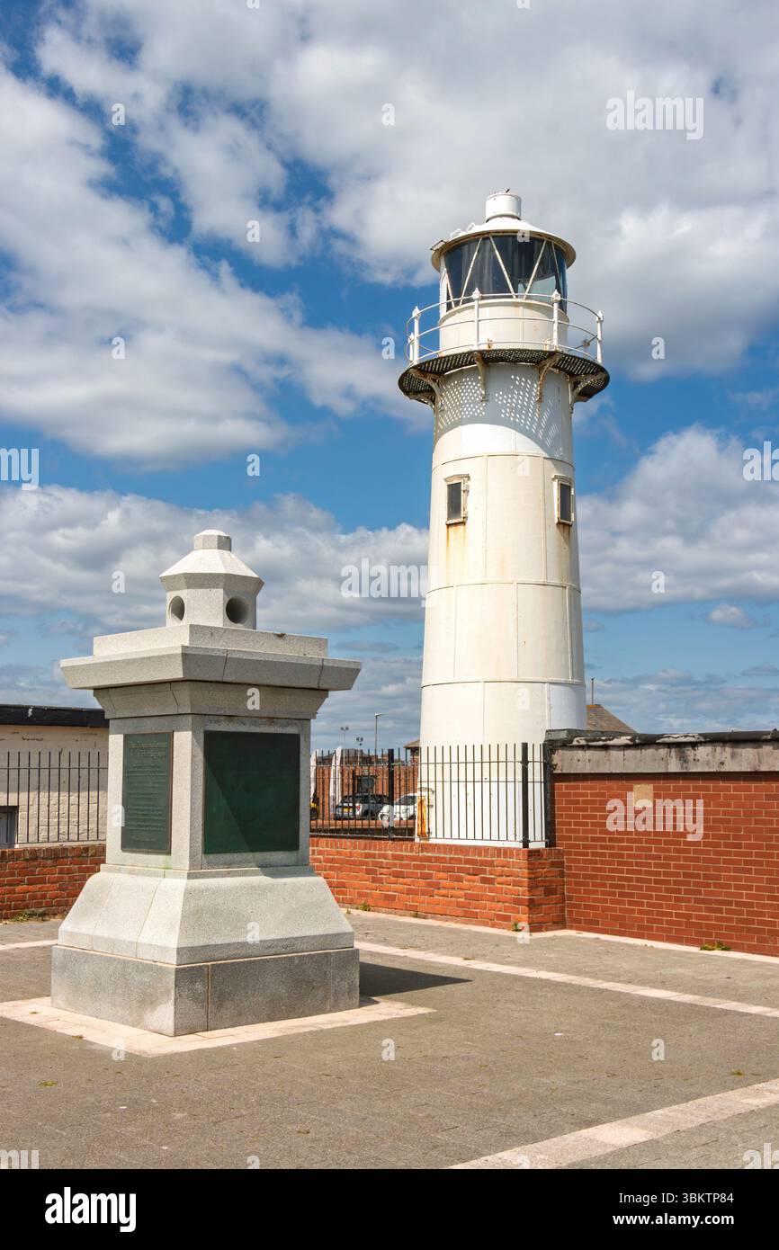 Historical lighthouse Heugh light with adjacent monument and clear blue sky in the background on a sunny day in  hartlepool Stock Photo