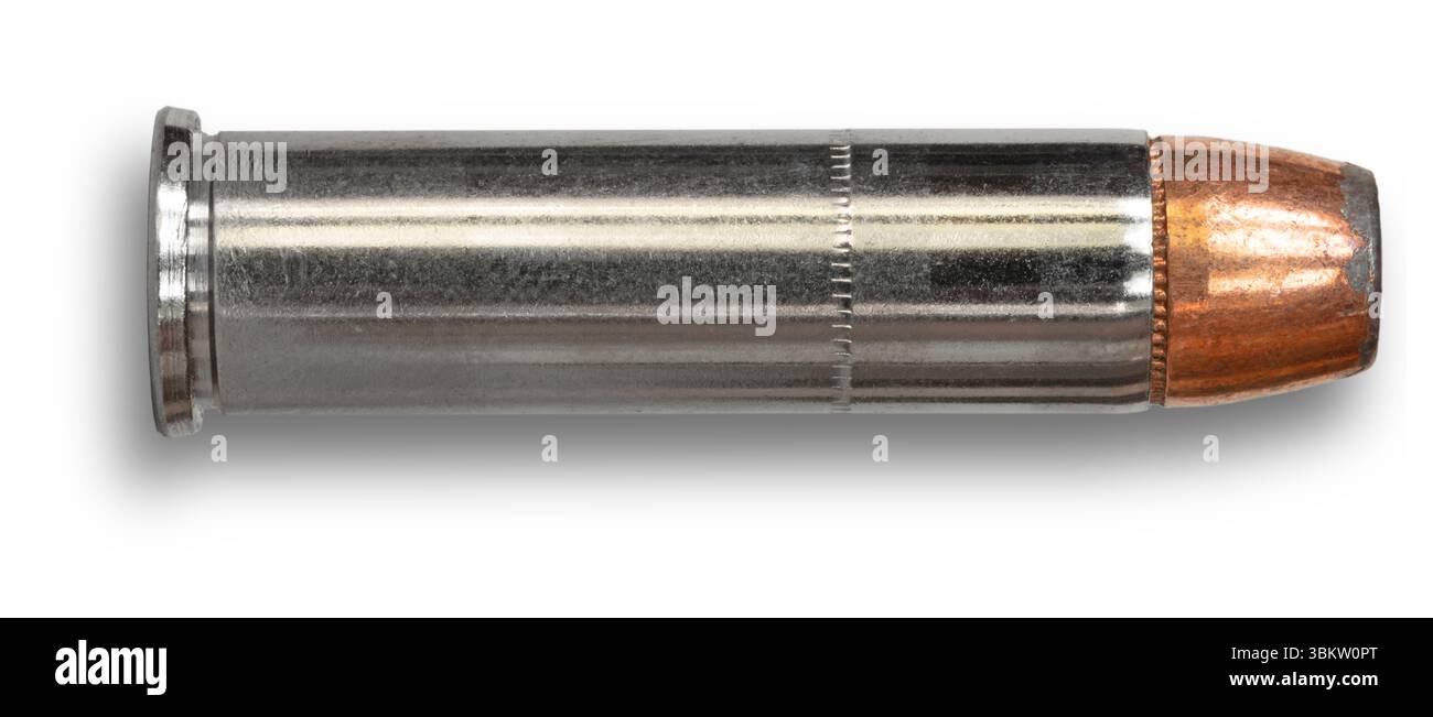 Shadow below a nickel plated 357 magazine cartridge with a copper ...