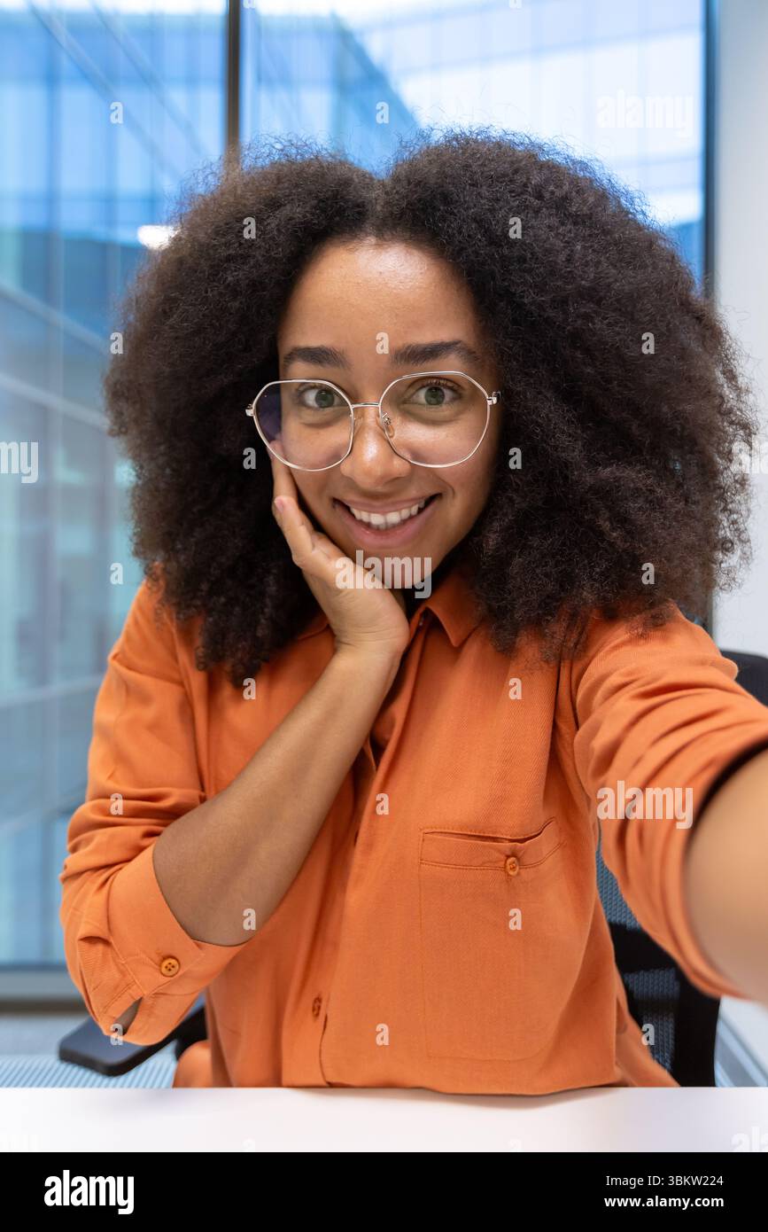 Woman wearing orange shirt hi-res stock photography and images - Alamy