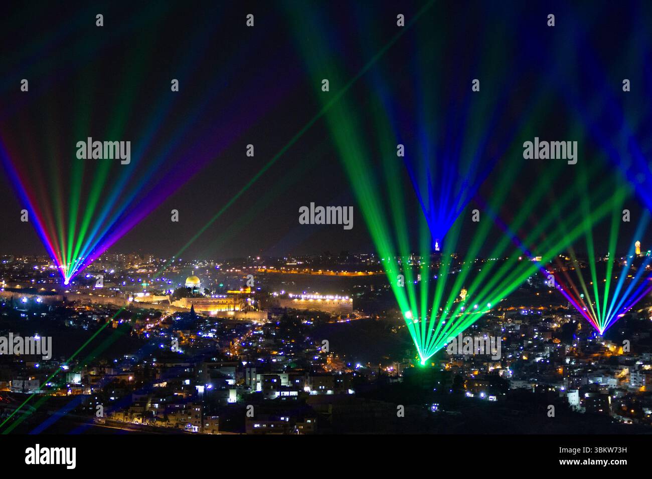 Light show illuminates the night sky over Jerusalem, Israel with the ancient Old City in the background Stock Photo