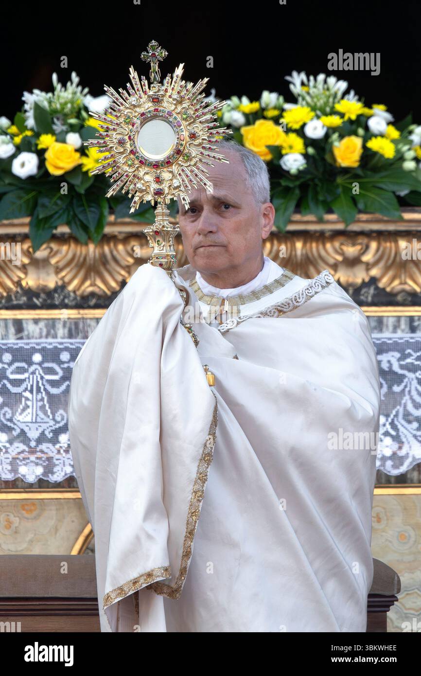 Pope Leo XIV holds up the monstrance in front of St. Mary
