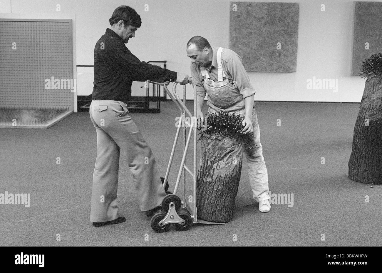 The artist Guenther Uecker (right) sets up his exhibition on April 11, 1985, with Ulrich Schumacher, founding director of Quadrat Bottrop. Stock Photo