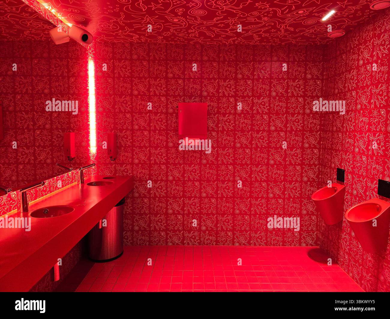 The red theme decor of the bathroom at Hotel AX in Välimerenkatu, Helsinki, Finland. - Smartphone Captured Stock Image