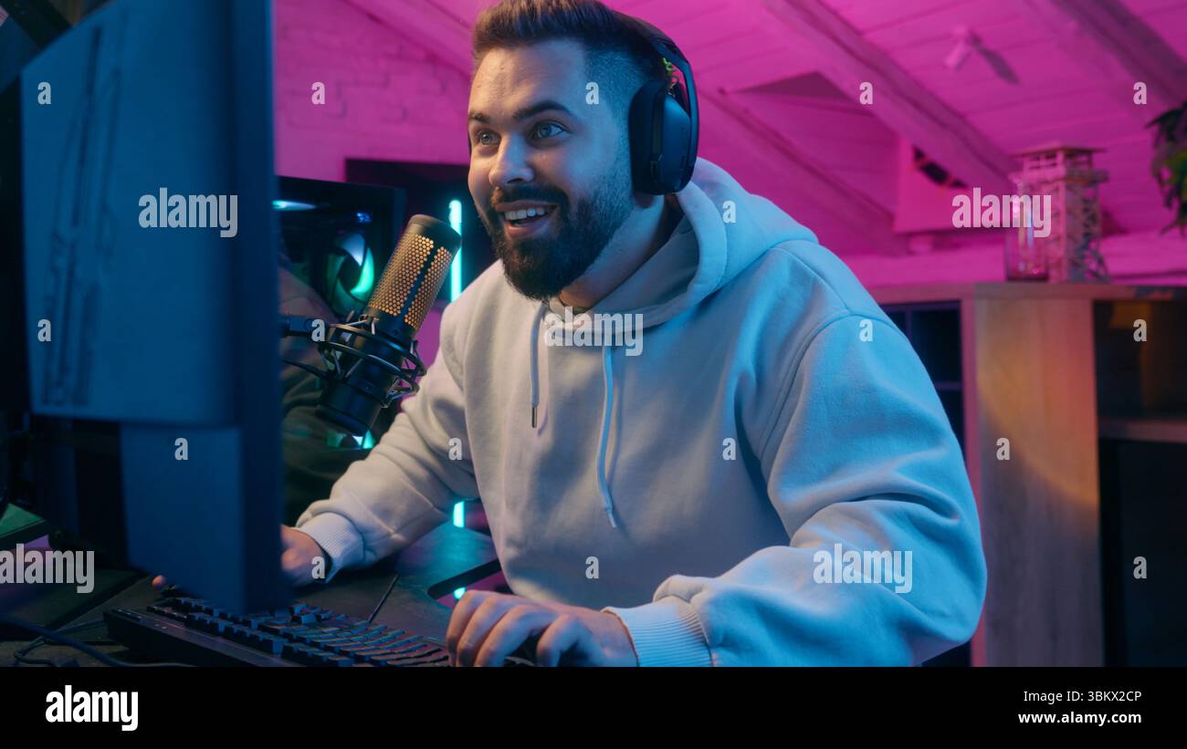 Winner man gamer wearing earphones hi-res stock photography and images ...