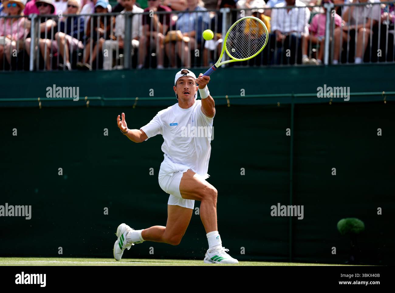 Ryan Peniston in action against Facundo Bagnis, during Wimbledon ...