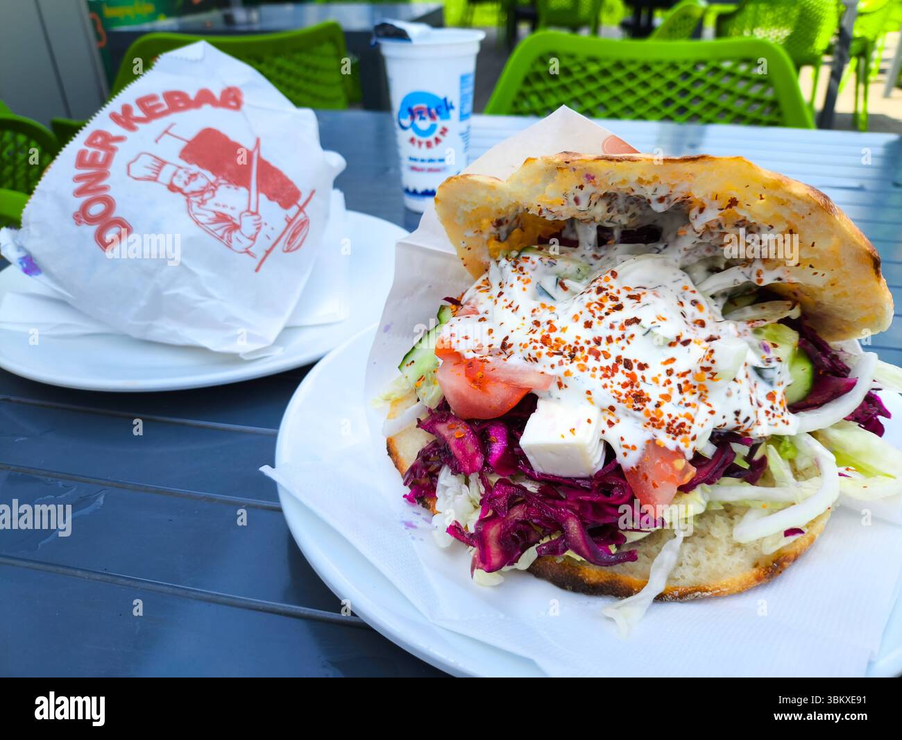 Bavaria, Germany - June 23, 2025: Fresh kebab in flatbread with lettuce ...