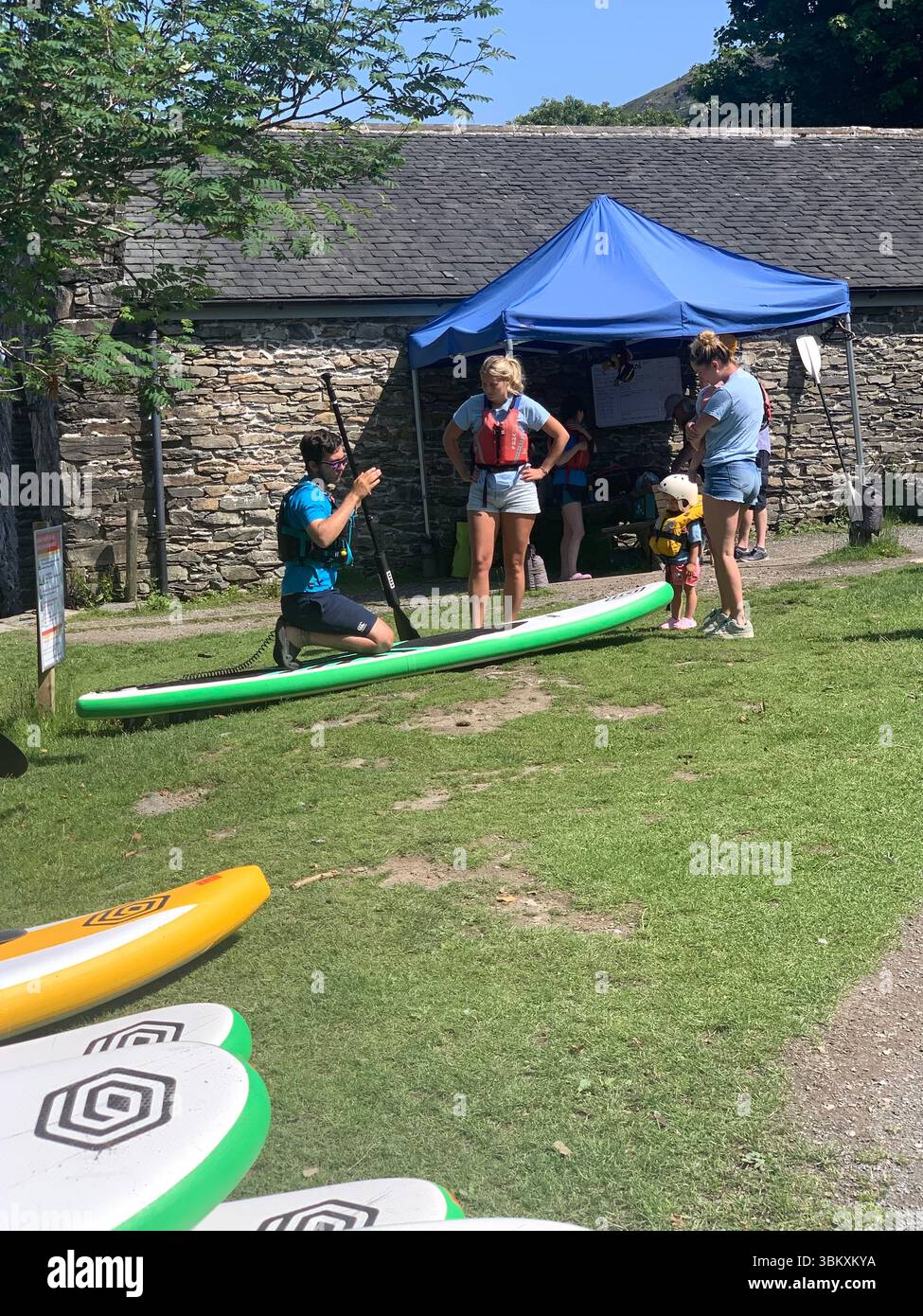 Ulverston Newby Bridge Lakeside lake district Swan Hotel  River Leven Lake Windermere Ambleside water lake sports sport boats boat Cumbria people UK - Smartphone Captured Stock Image