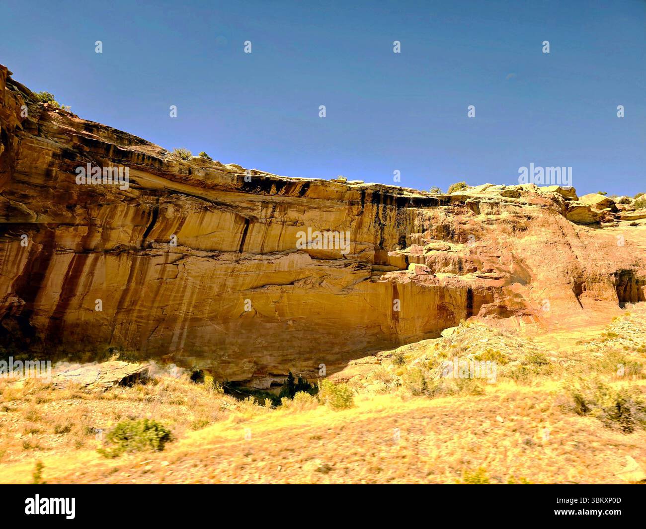 Curving train tracks beside a river running through a small Colorado mountain town. - Smartphone Captured Stock Image