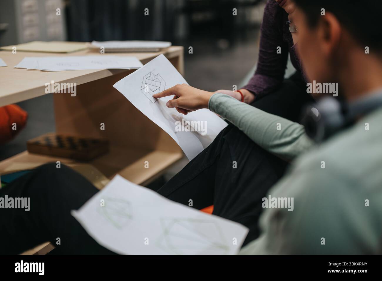 High school students engaged in collaborative classroom activity Stock Photo