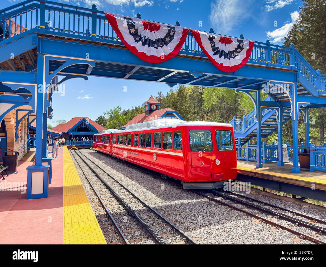 Manitou Springs, Colorado, USA - 21 May 2025: Train on the Manitou and Pike's Peak Cog railway alongside one of the platforms of the base station - Smartphone Captured Stock Image