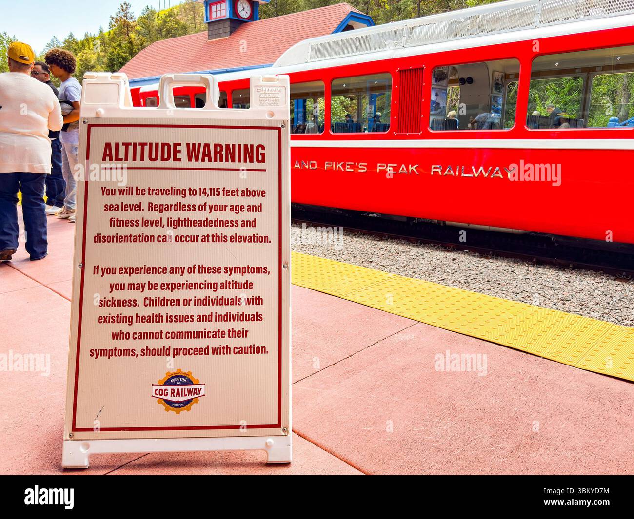 Manitou Springs, Colorado, USA - 21 May 2025: Warning sign about altitude for tourists catching a train on the Manitou and Pike's Peak Cog railway - Smartphone Captured Stock Image