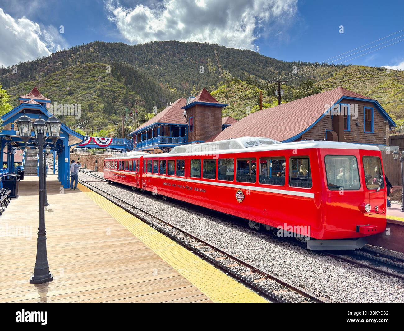 Manitou Springs, Colorado, USA - 21 May 2025: Train on the Manitou and Pike's Peak Cog railway alongside one of the platforms of the base station - Smartphone Captured Stock Image