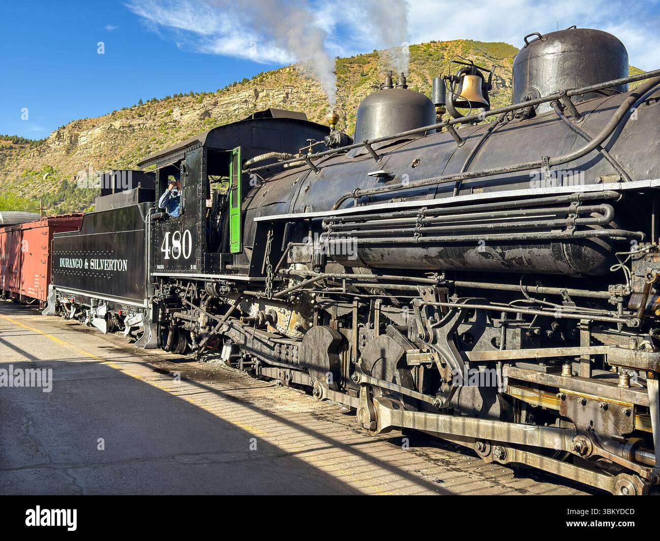 Durango, Colorado, USA - 23 May 2025: Vintage steam engine on the Durango and Silverton narrow gauge railway leaving the station in Durango - Smartphone Captured Stock Image