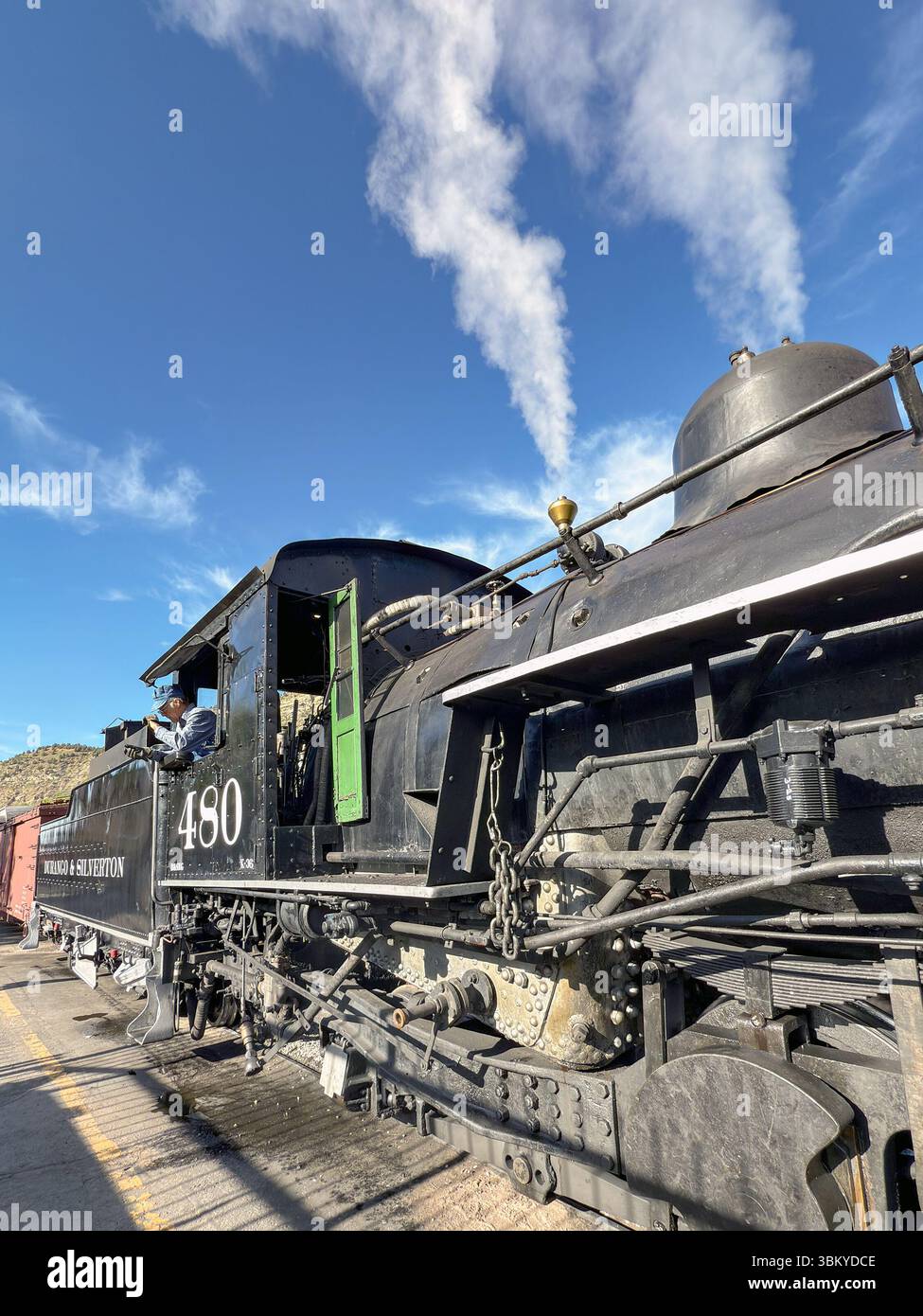 Durango, Colorado, USA - 23 May 2025: Vintage steam engine on the Durango and Silverton narrow gauge railway leaving the station in Durango - Smartphone Captured Stock Image