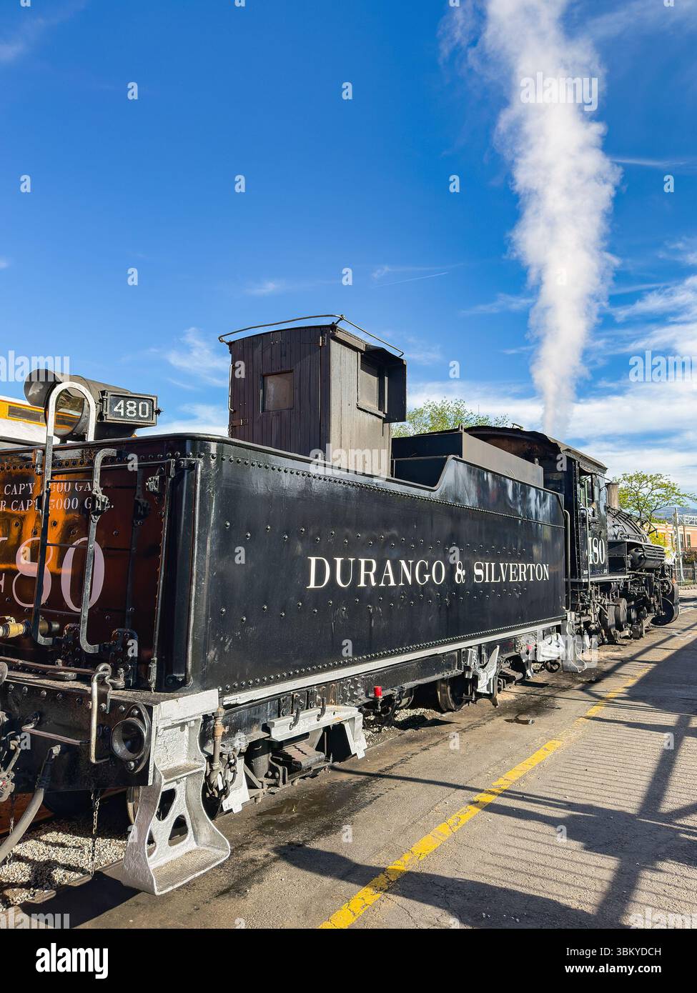 Durango, Colorado, USA - 23 May 2025: Vintage steam engine on the Durango and Silverton narrow gauge railway leaving the station in Durango - Smartphone Captured Stock Image
