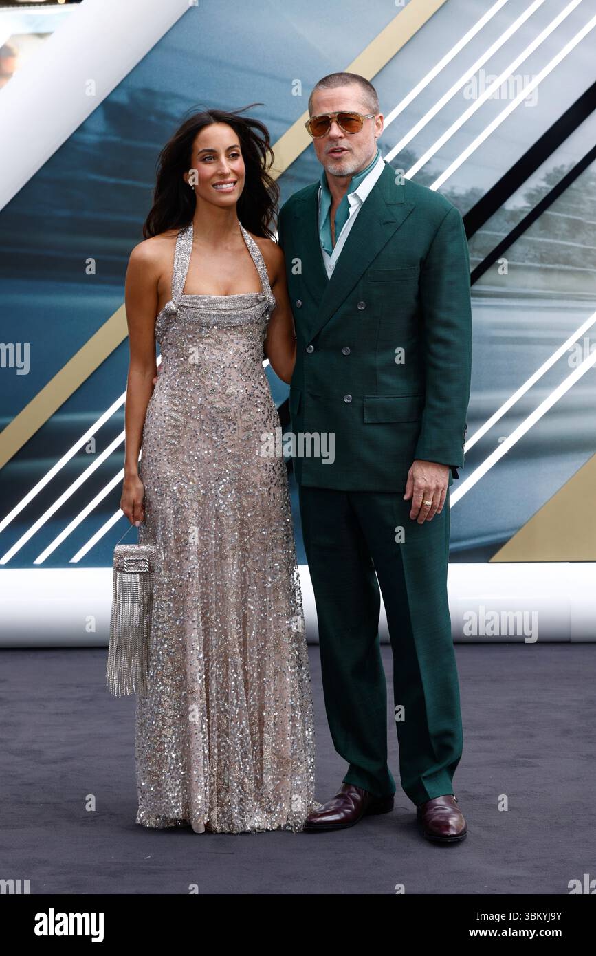 Ines de Ramon, left, and Brad Pitt pose for photographers upon arrival ...