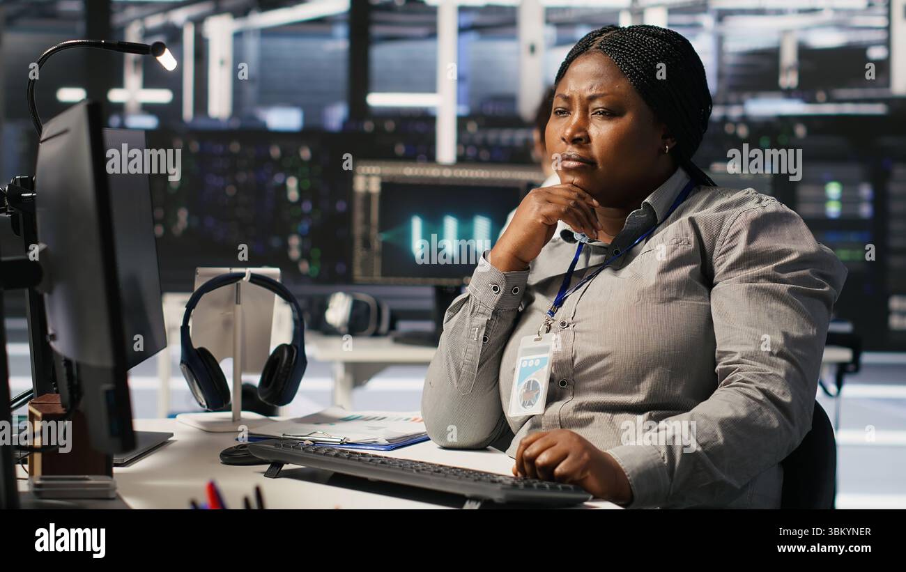 Woman in data center doing software updates, verifying machine learning ...