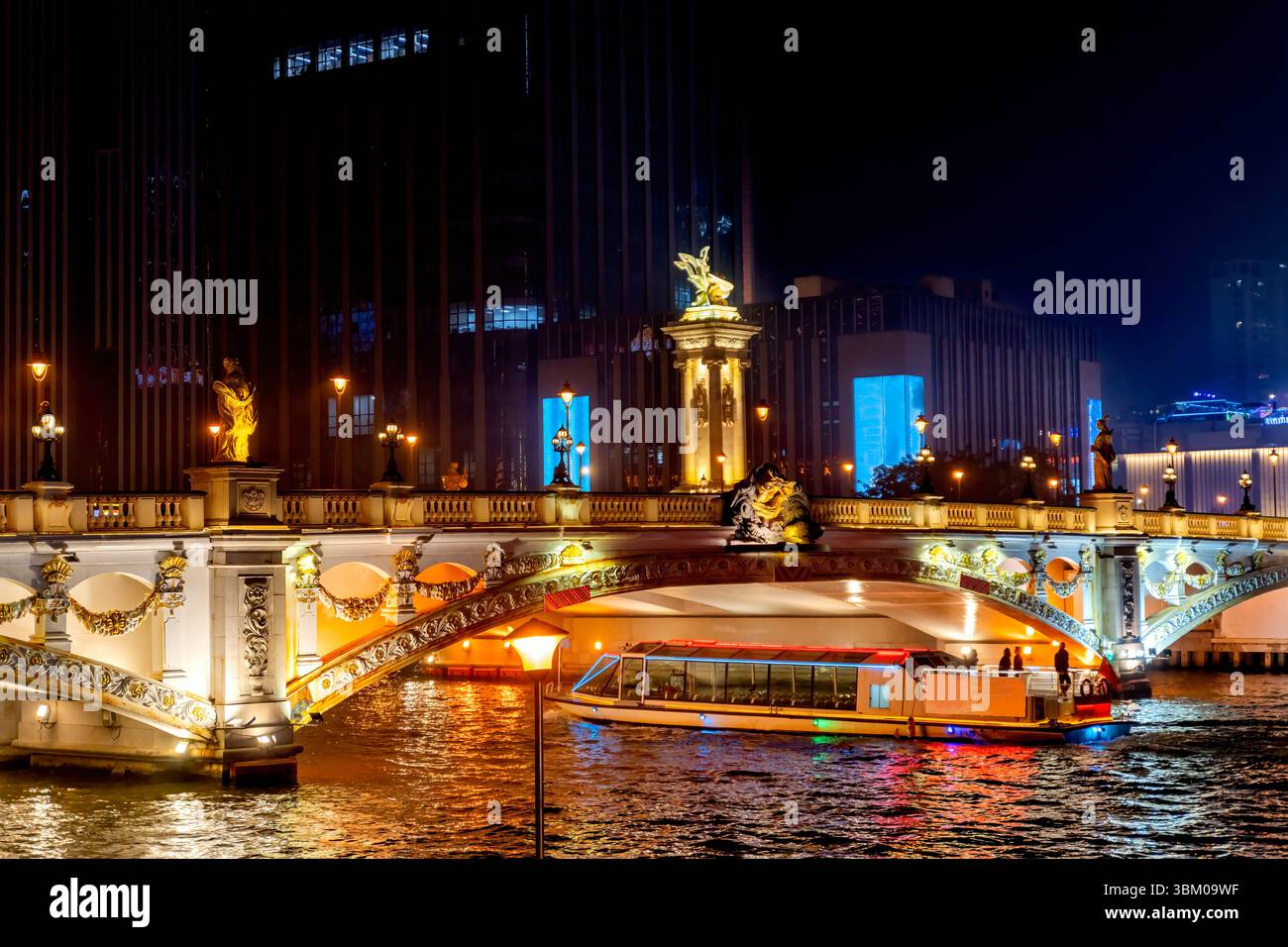Colorful tourist boat Beian Bridge and illuminated Hai River, Tianjin, China. Built in 1939. Mix of Chinese and European culture with Chinese and Fren Stock Photo