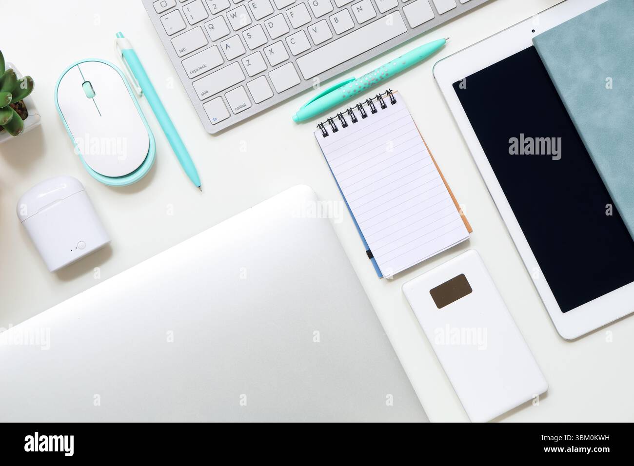 Different gadgets with notebooks on white background Stock Photo