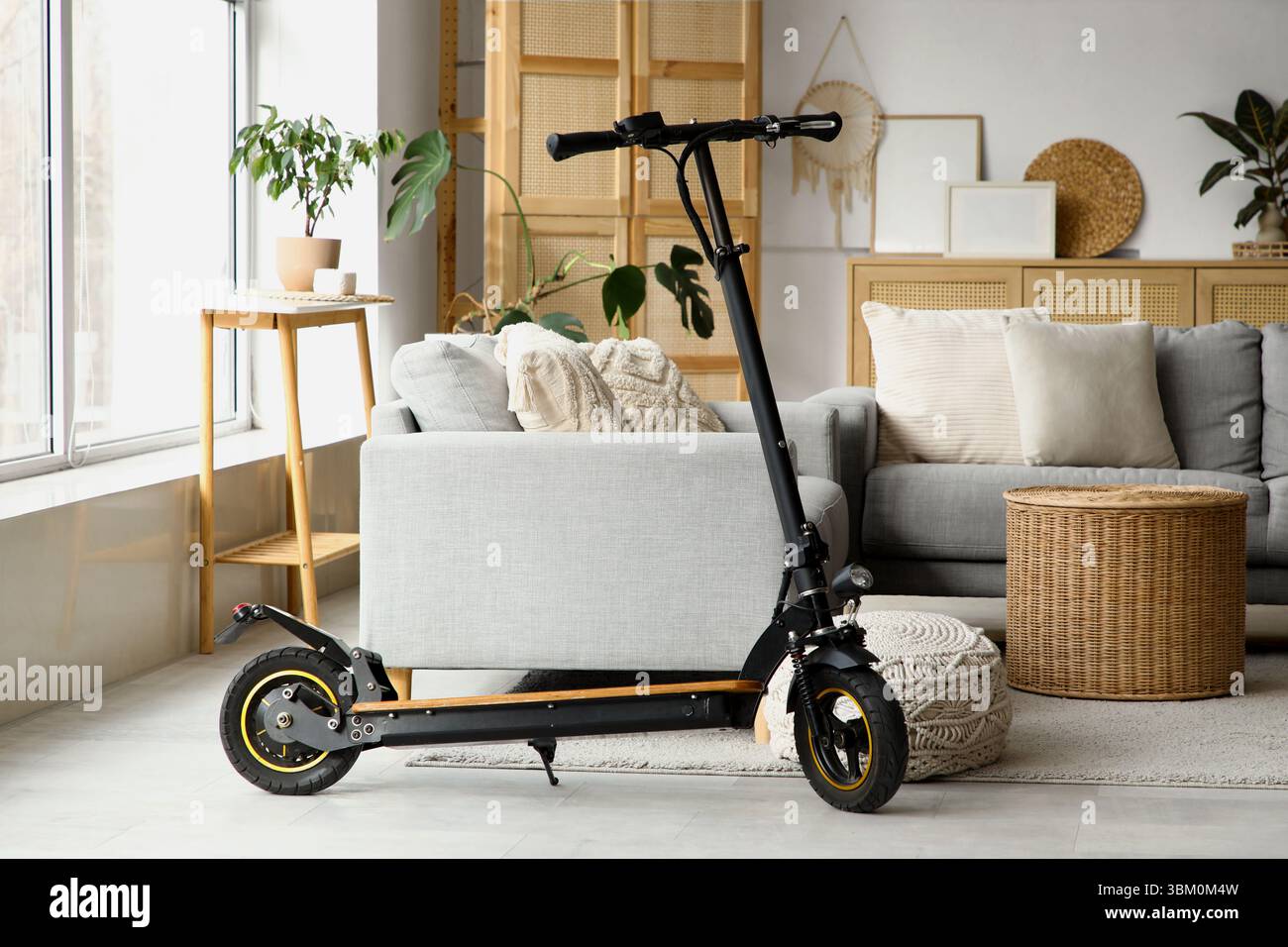 Scooter Inner Design Interior of living room with electric scooter and sofas Stock Photo - Alamy