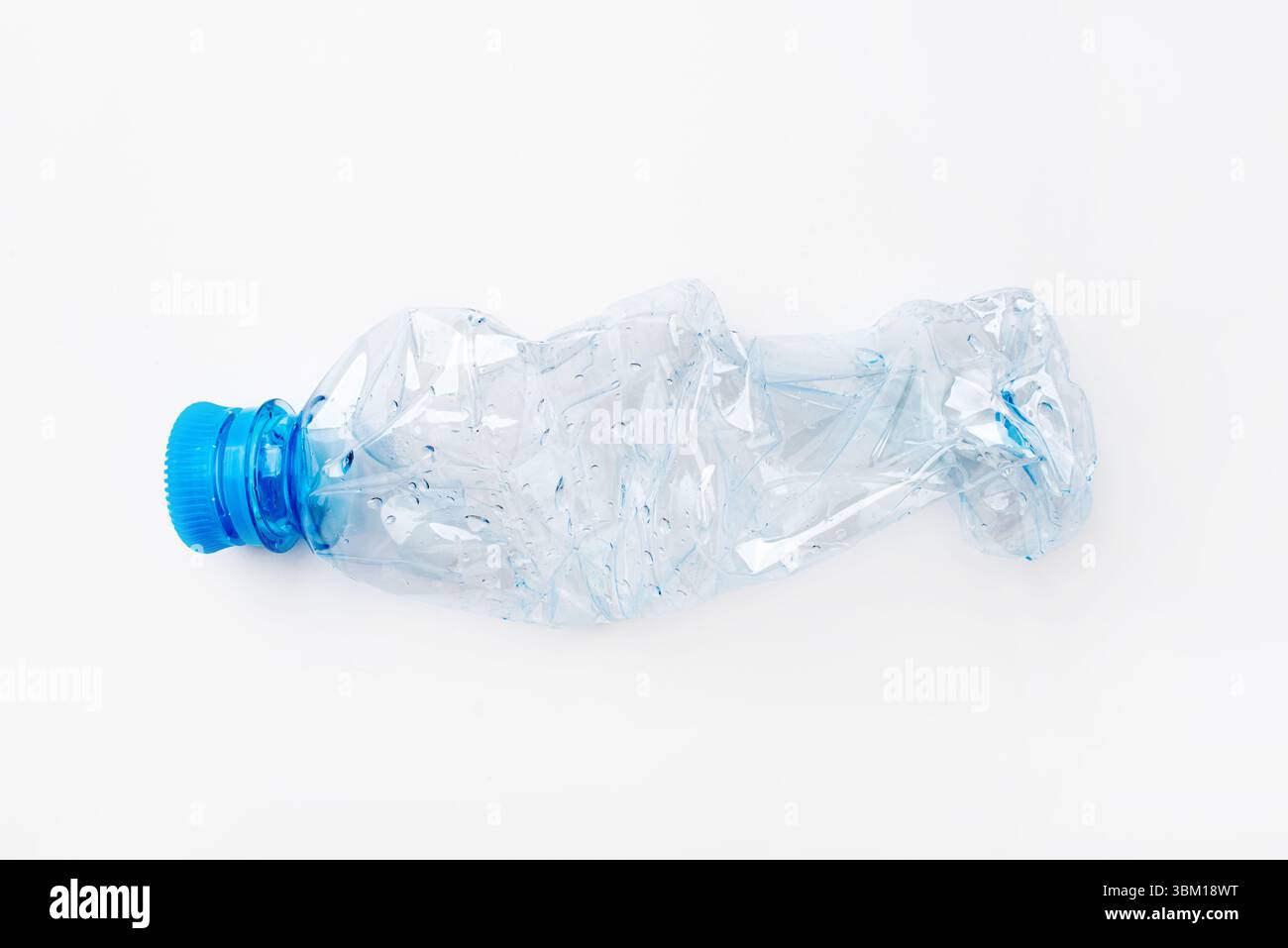 Crumpled empty plastic bottle on a white background Stock Photo