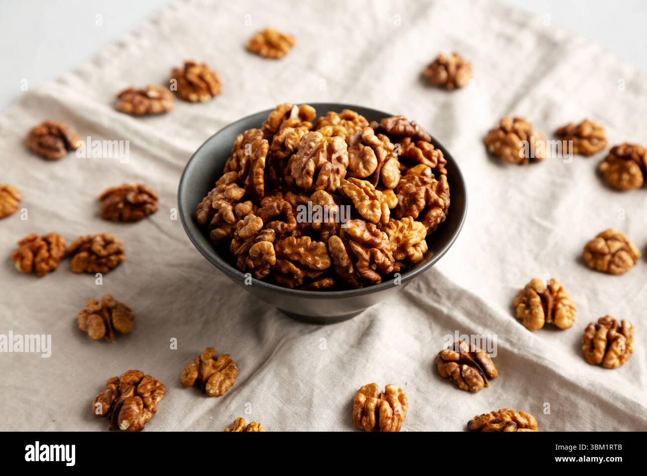 Raw Walnut Halfs in a Bowl, side view. Stock Photo