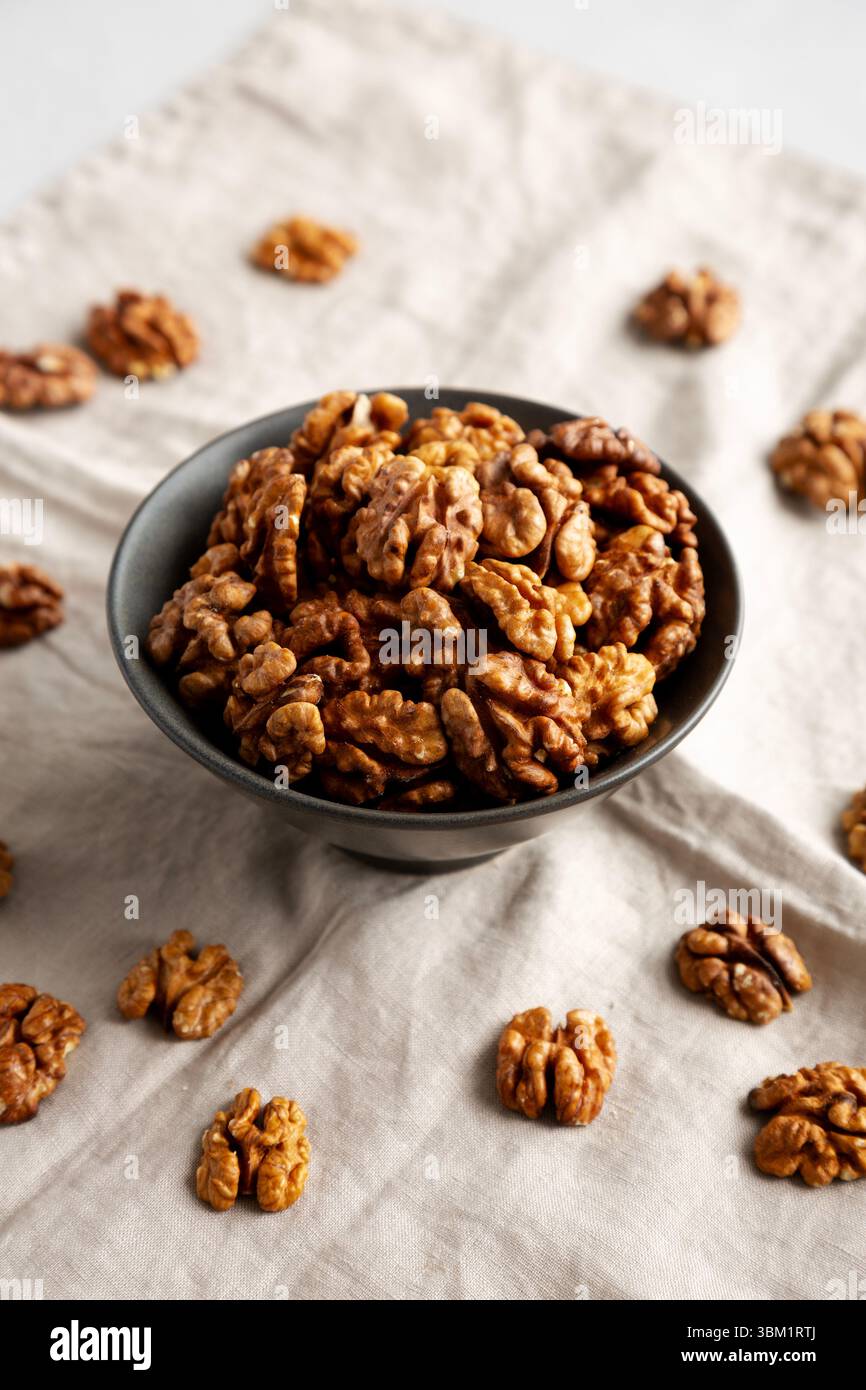 Raw Walnut Halfs in a Bowl, side view. Stock Photo