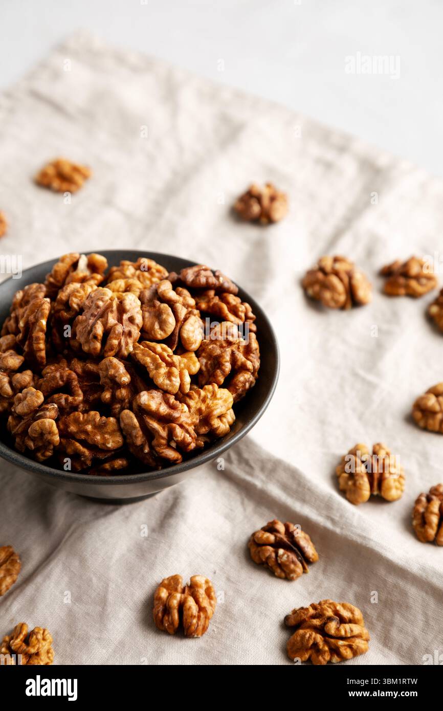 Raw Walnut Halfs in a Bowl, side view. Stock Photo