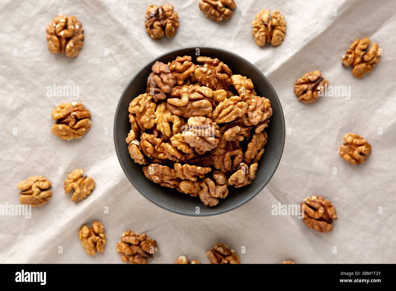 Raw Walnut Halfs in a Bowl, top view. Stock Photo