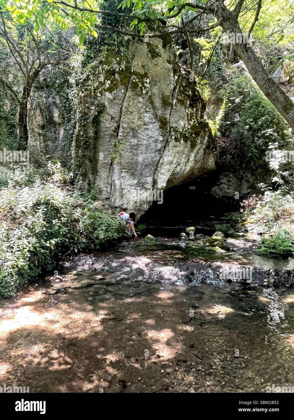 Entrance to the Waterfall cave, the spring of the Maarata River, located at Krushuna Waterfalls, Bulgaria karst nature reserve, Europe, Balkans - Smartphone Captured Stock Image