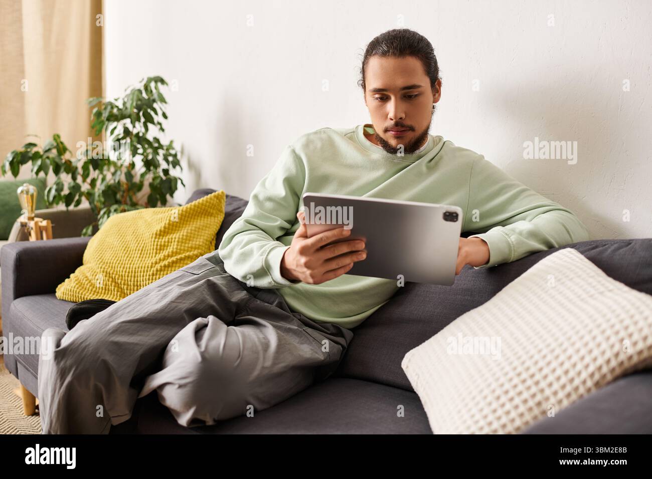 Focused man thoughtful expression enjoys hi-res stock photography and ...