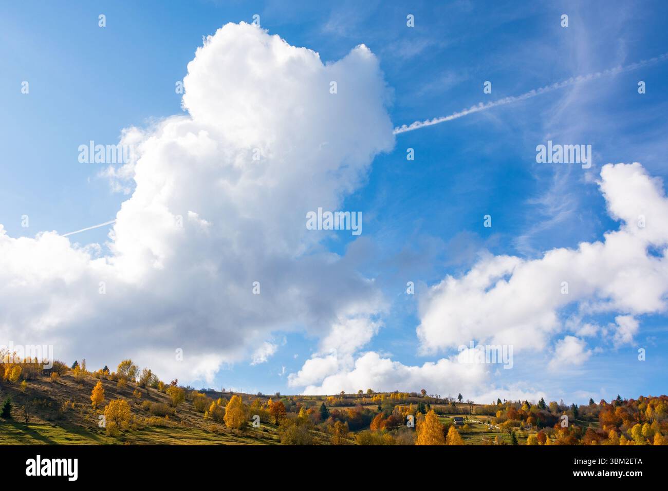 white cumulus clouds on a blue sky. wonderful nature background of atmosphere condition in day light. bright autumn weather forecast. fresh air. sceni Stock Photo