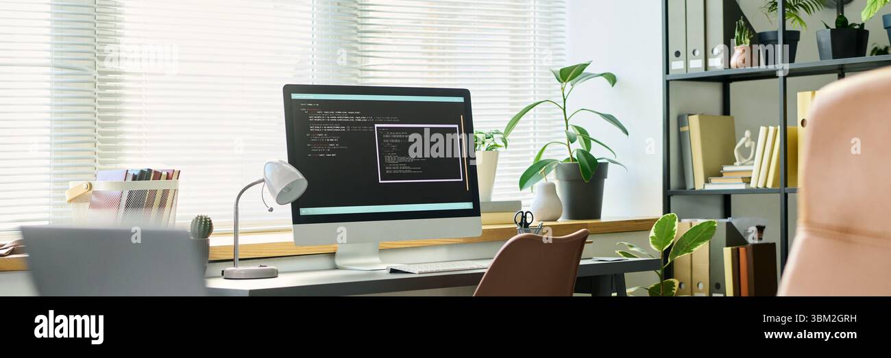 Modern Workspace Featuring Computer Screen Displaying Neural Network Coding Stock Photo