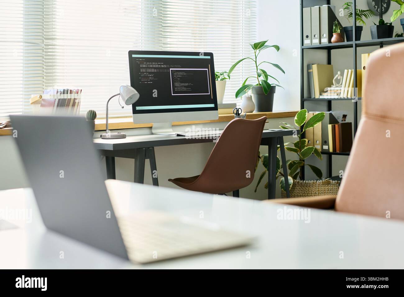 Modern Office Workspace Featuring Computer Developing Neural Network Code Stock Photo